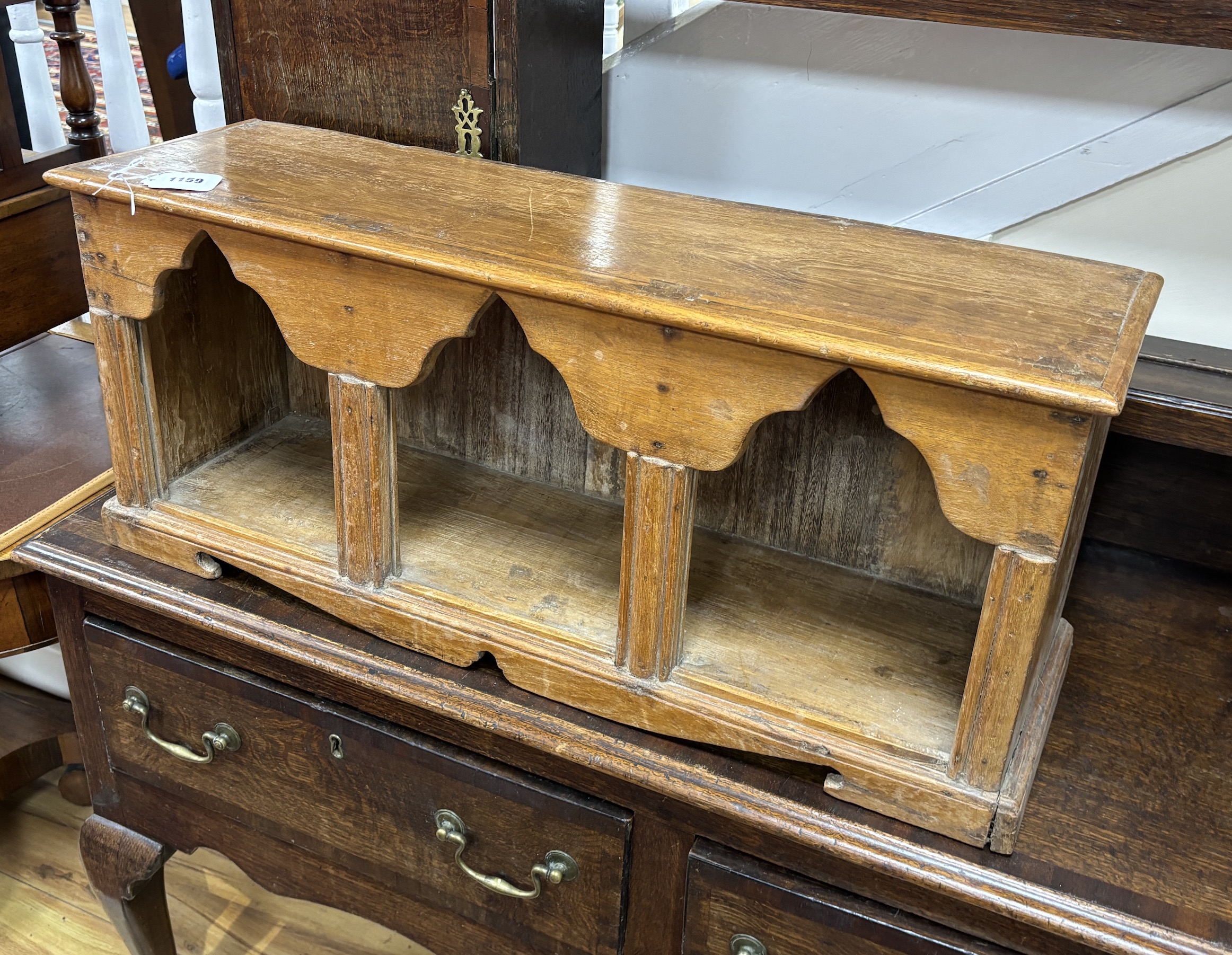 An Indonesian hardwood wall cabinet, width 77cm, depth 24cm, height 33cm